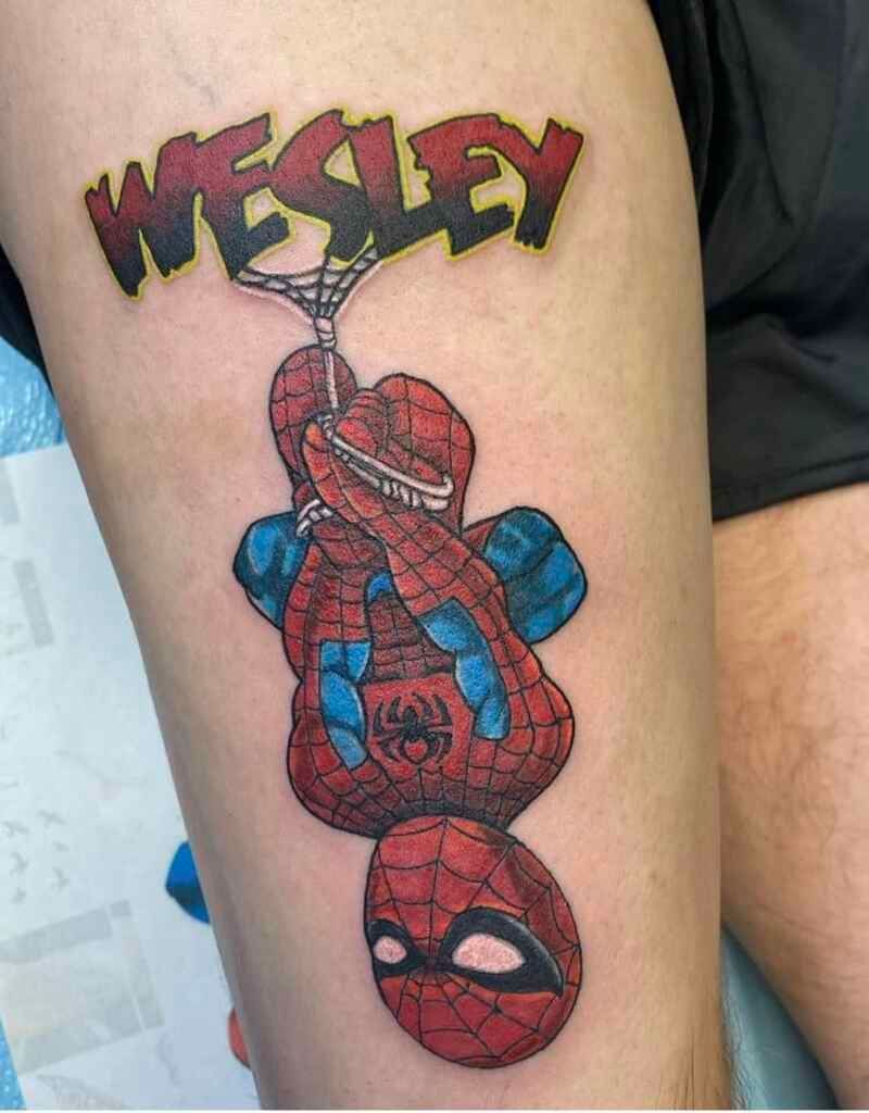 A tattoo of a spider man with the name wesley on it
