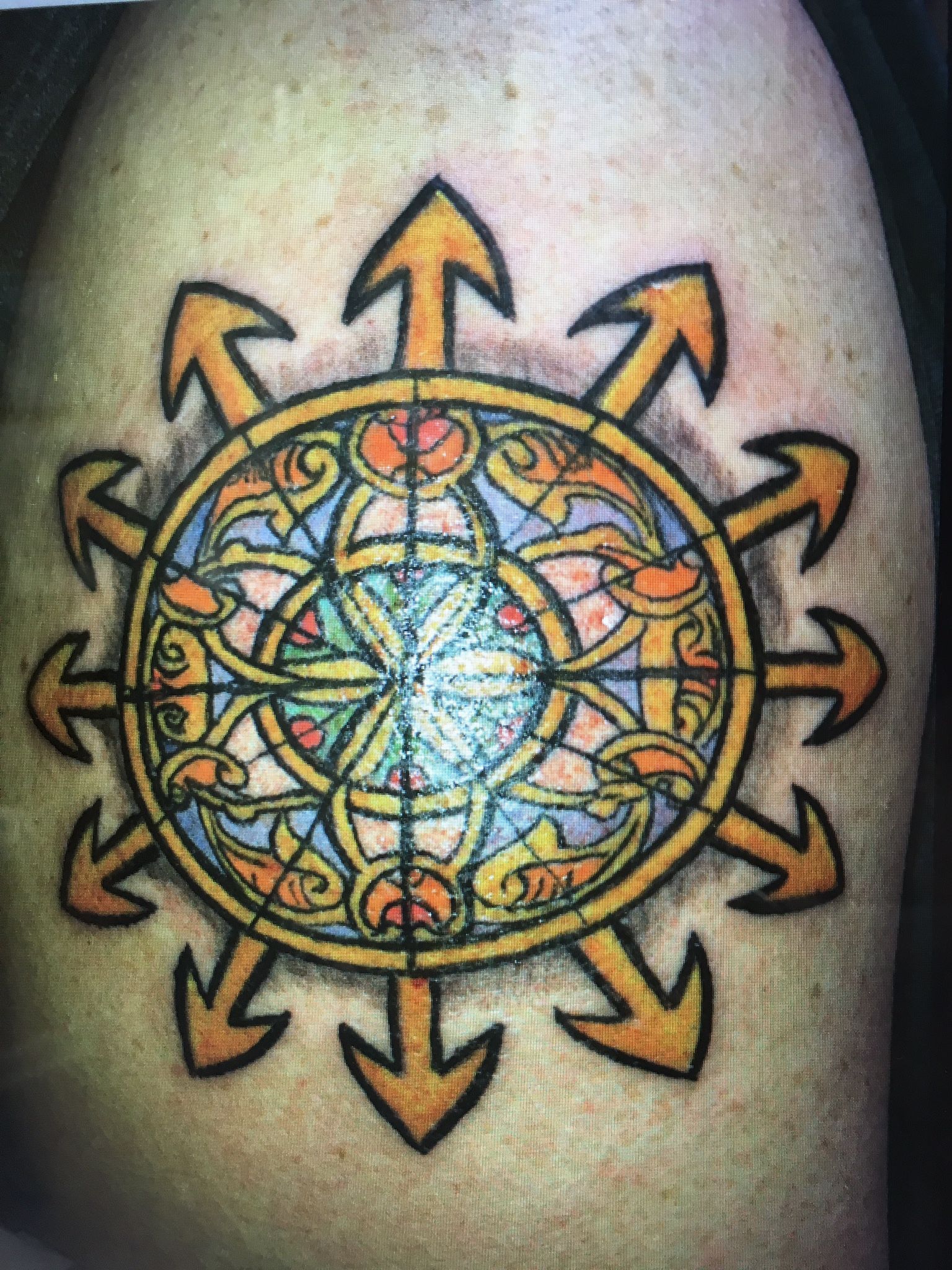 A close up of a tattoo on a person 's arm.
