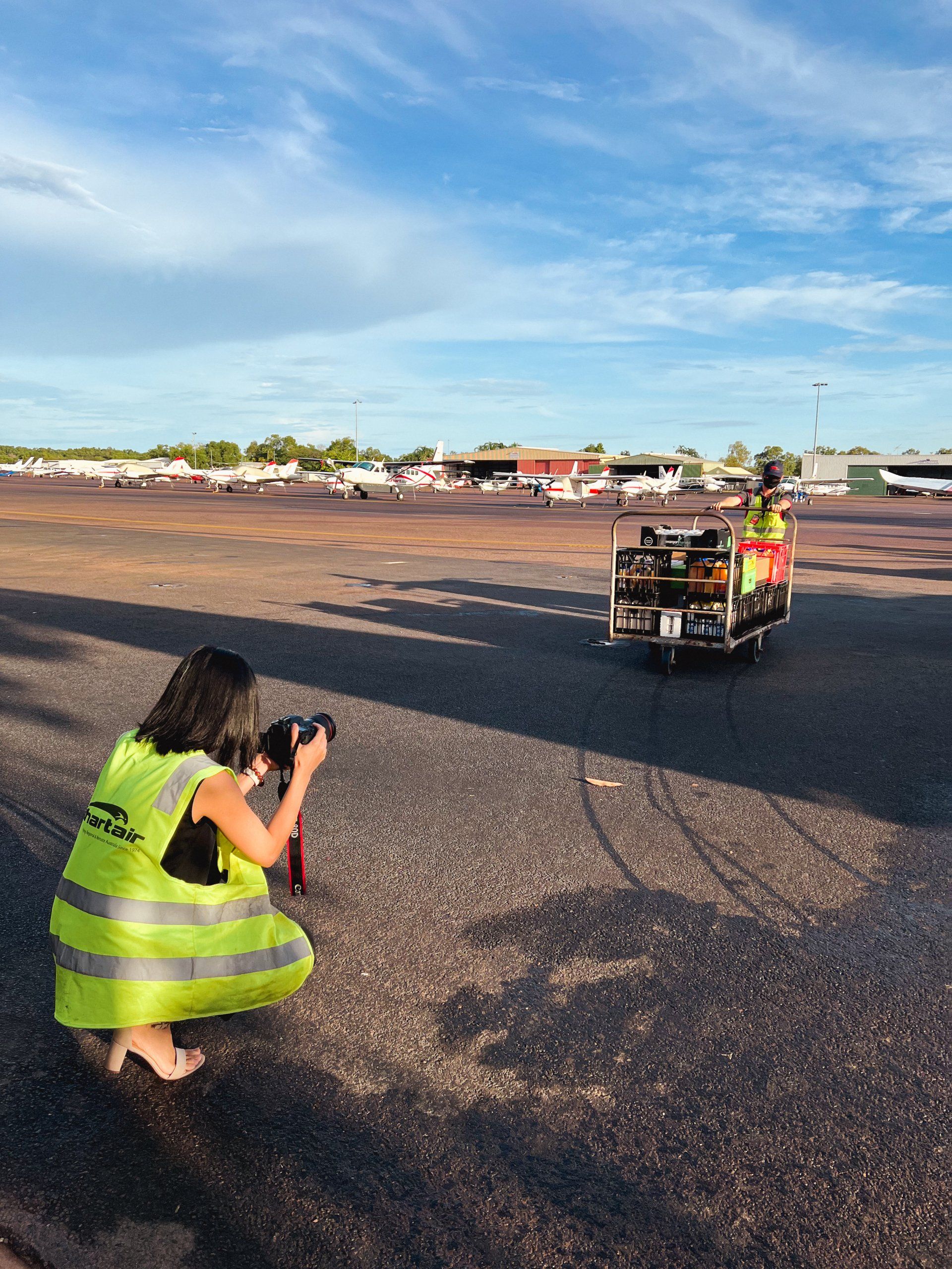 Chartair staff are loading groceries on an airplane to fly out from Darwin to  Peppimenarti and Palumpa