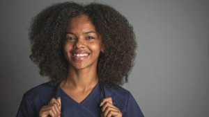A smiling black female nurse
