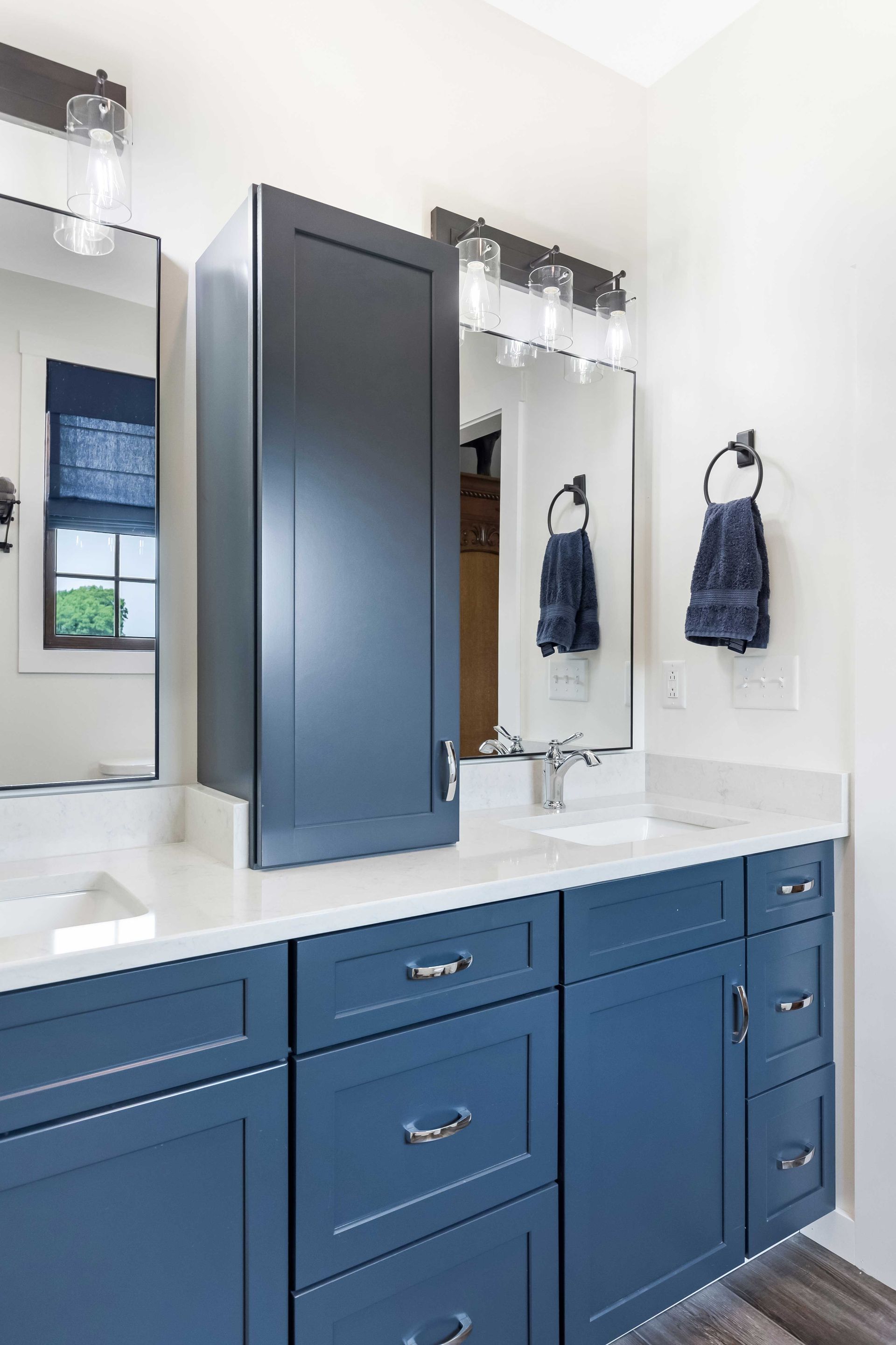 Mara Blanca Q Quartz Countertops with Waypoint Painted Navy Cabinets