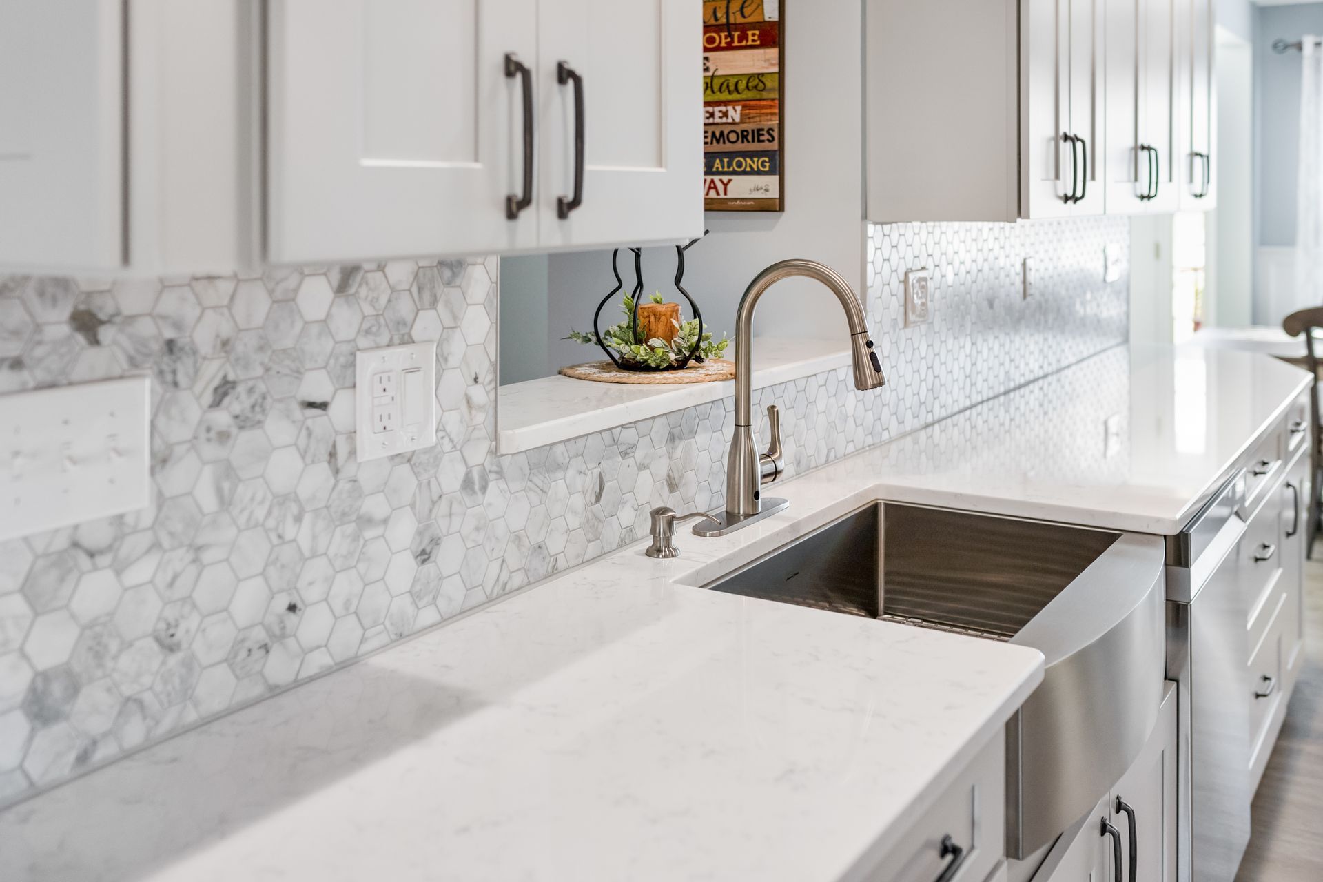 Cashmere Carrara Q Quartz Countertops, and Waypoint Painted Harbor Cabinets