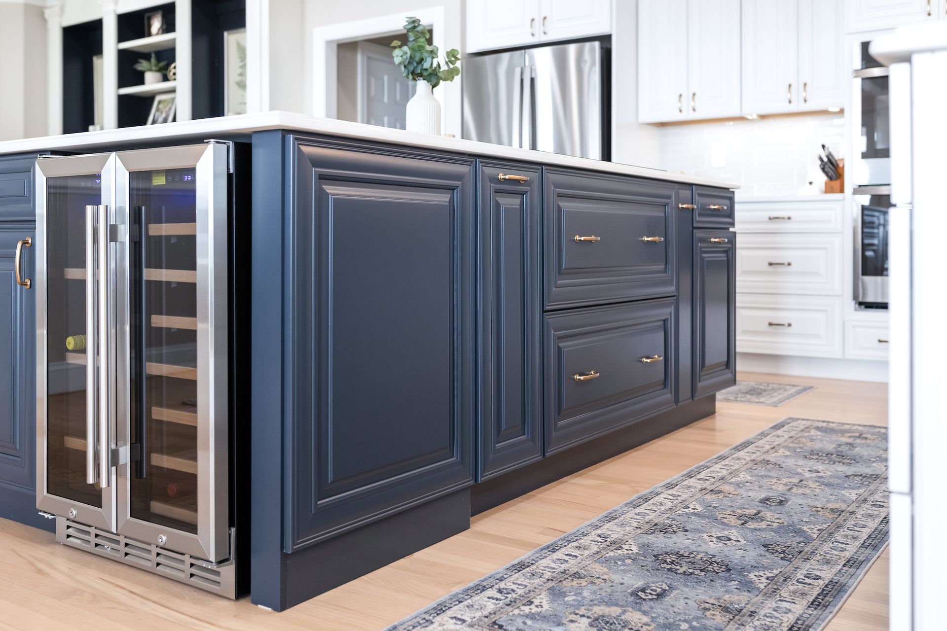 Calacatta Miraggio Cielo Q Quartz Countertops and Waypoint Painted Navy Island Cabinets