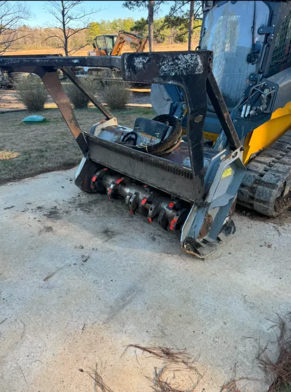 A bulldozer is parked on the side of the road.