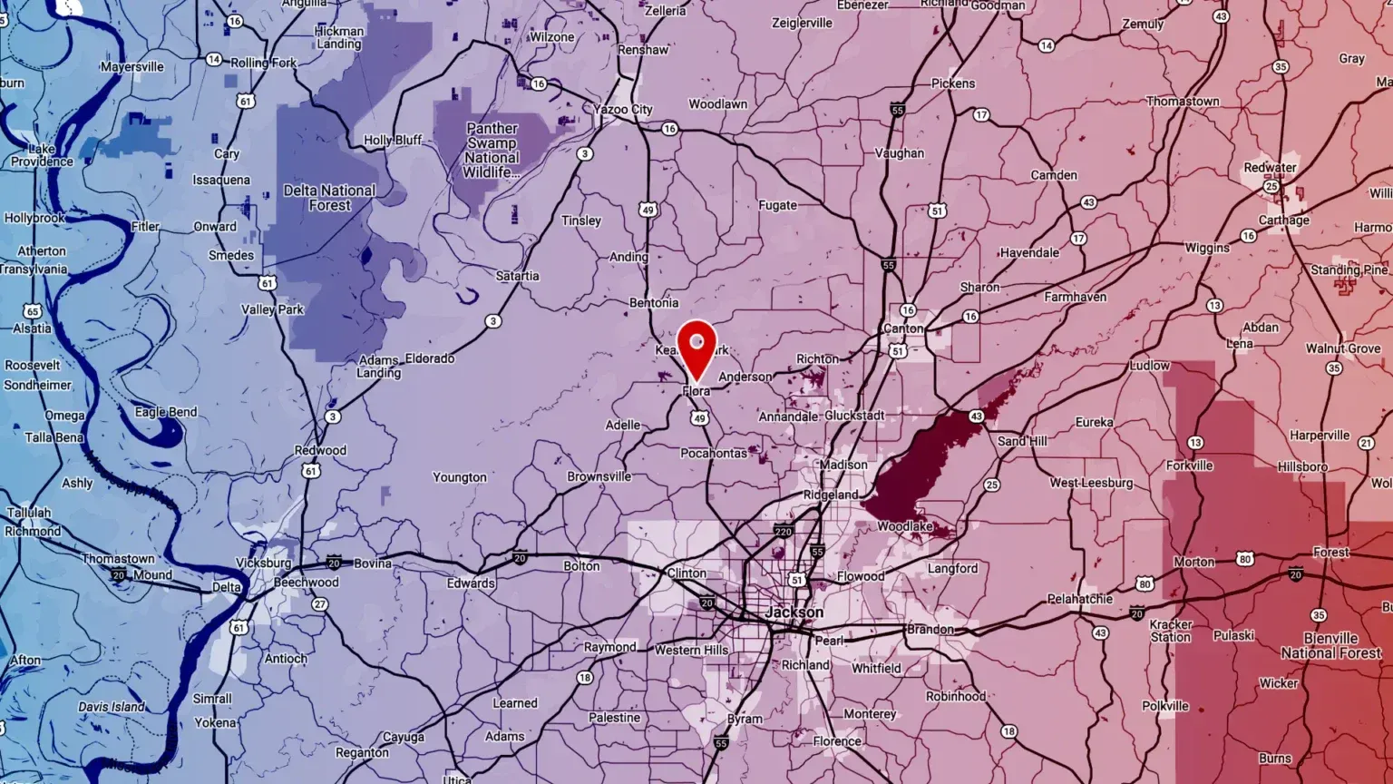 A map of a city with a red pin on it.