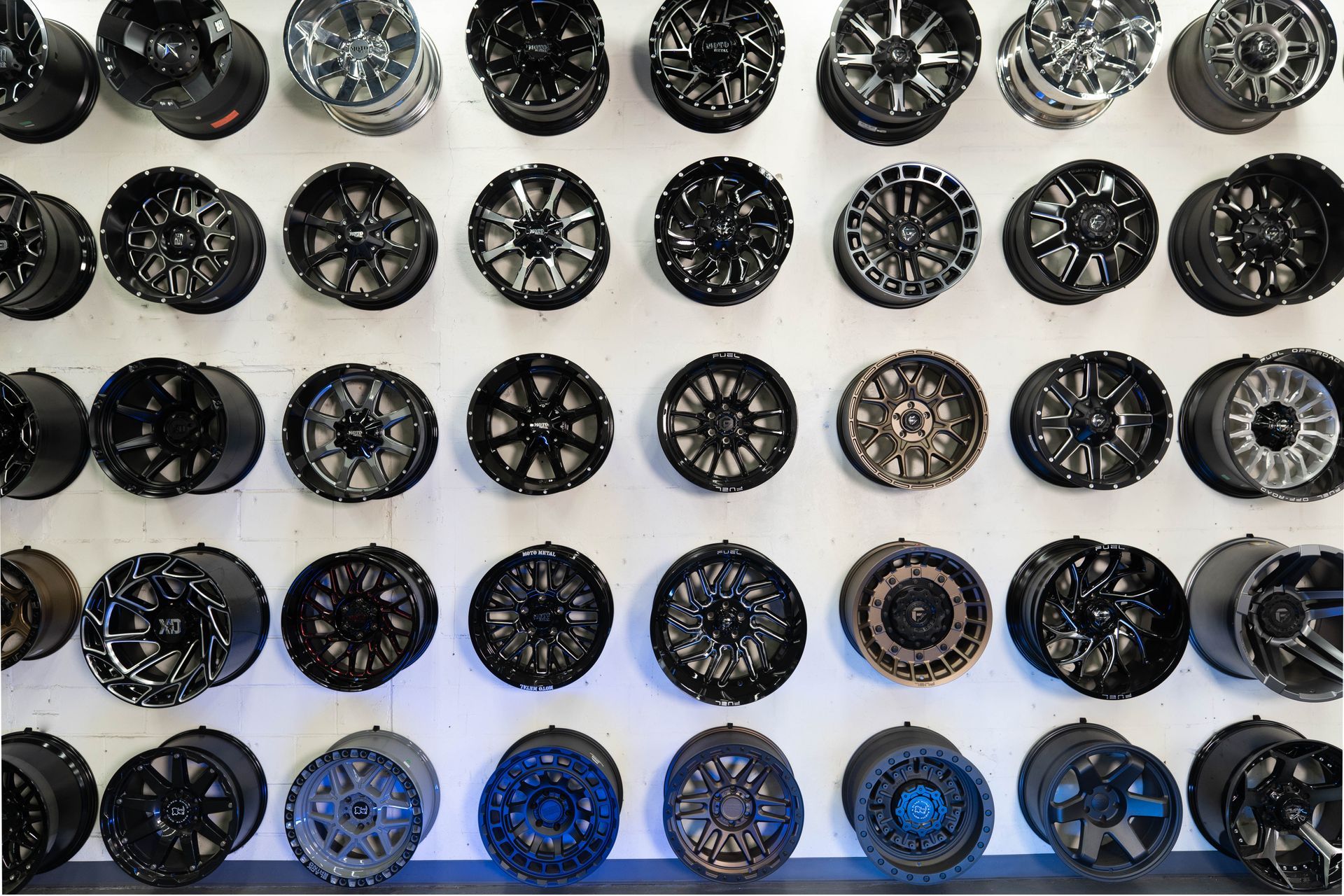 A wall filled with lots of different types of wheels