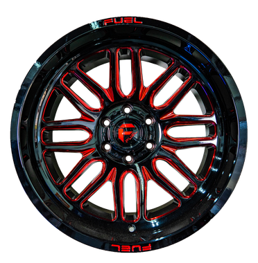 A close up of a red and black wheel on a white background.