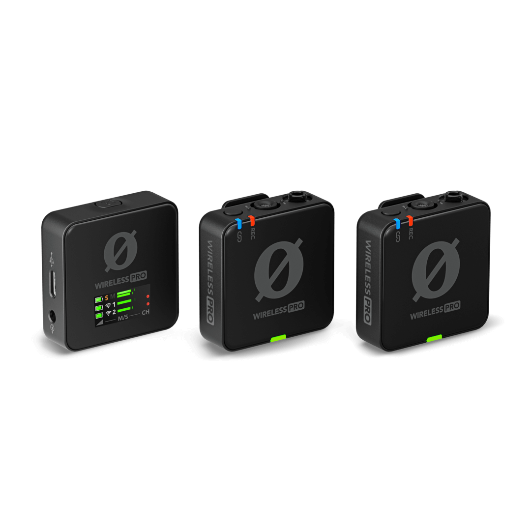 Three black Rode Wireless Go II units, one with an LCD screen and two with green buttons and blue/red indicators.