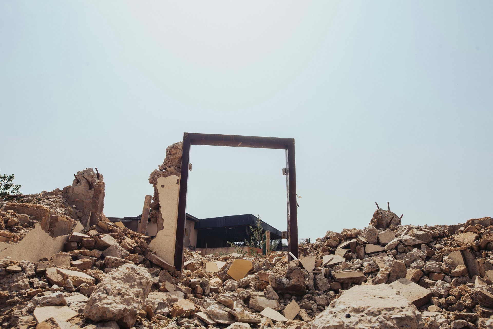 A doorway in the middle of a pile of rubble