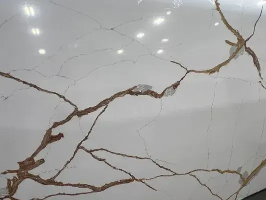 White marble surface with brown veining and reflective highlights.