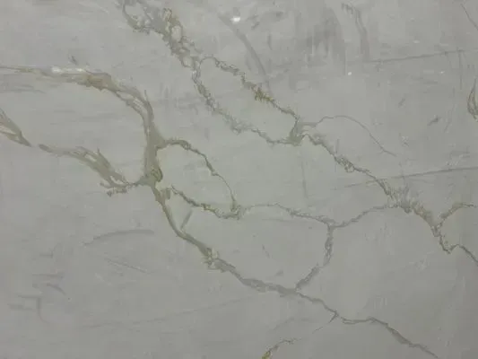White marble with light green veining.