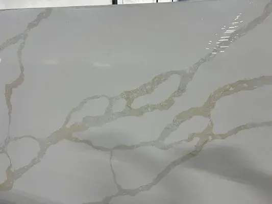White countertop with gold veining.