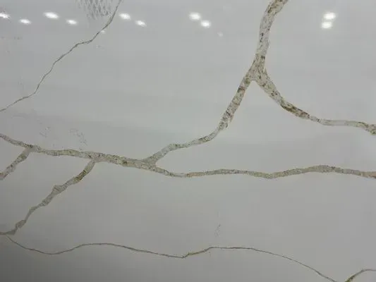 White surface with brown veining, resembling marble or quartz.