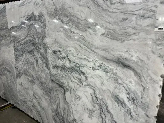 Large slab of polished marble with swirling gray and white patterns.