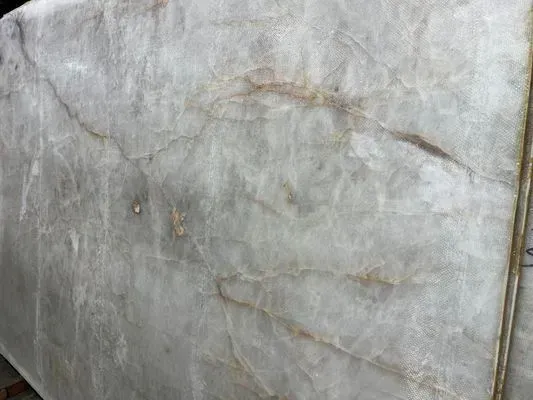 Pale stone slab with light veining.