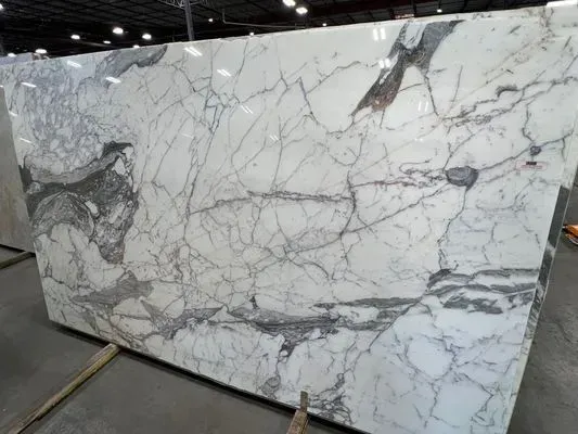 Large white marble slab with gray and brown veining.