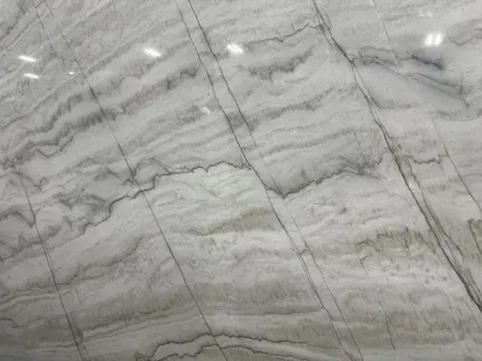 White marble slab with gray veining and striations.