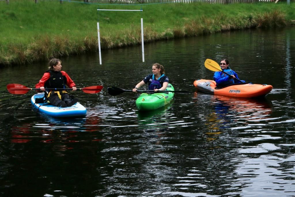 3 paddlers with an adapted boat