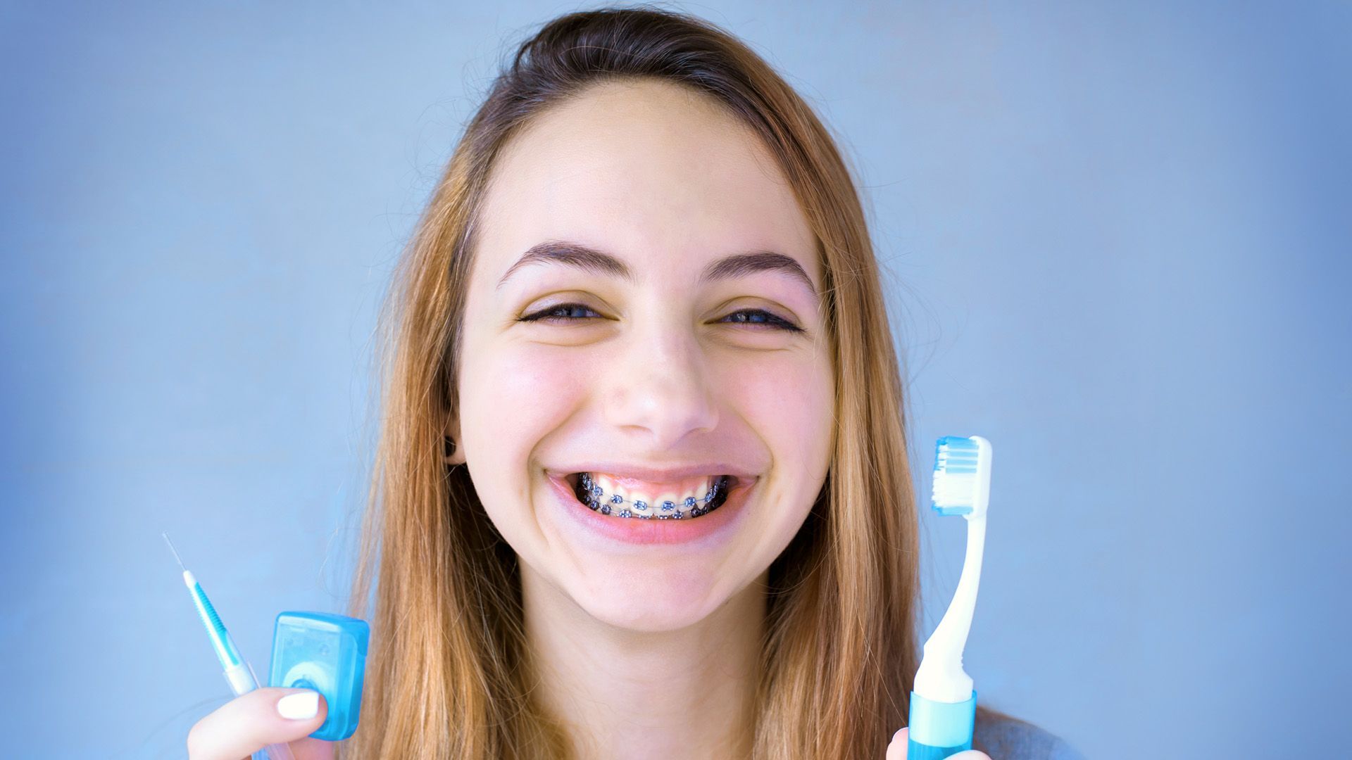 How to Help Your Kids Brush Better with Braces