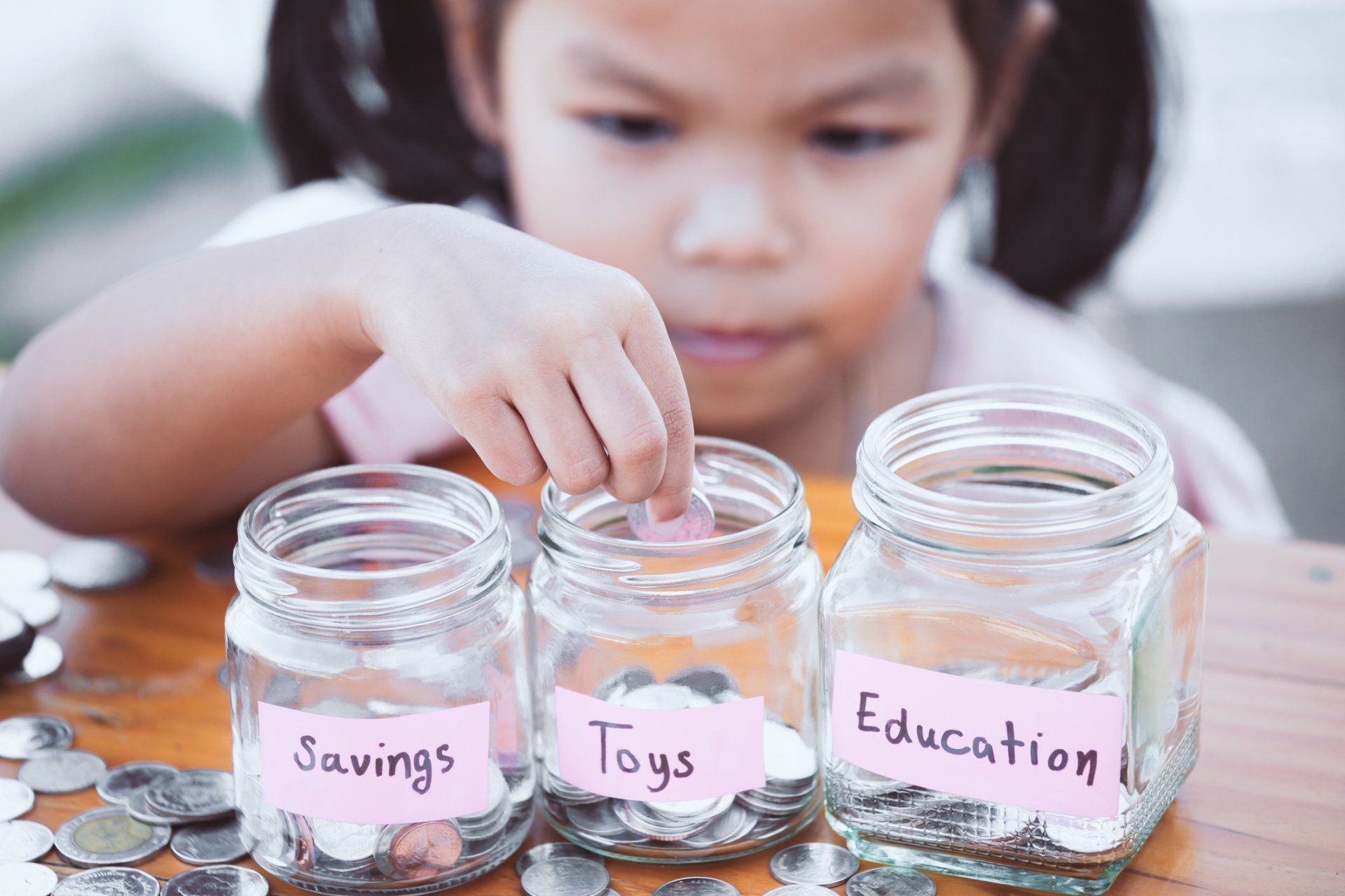 child with coin jar