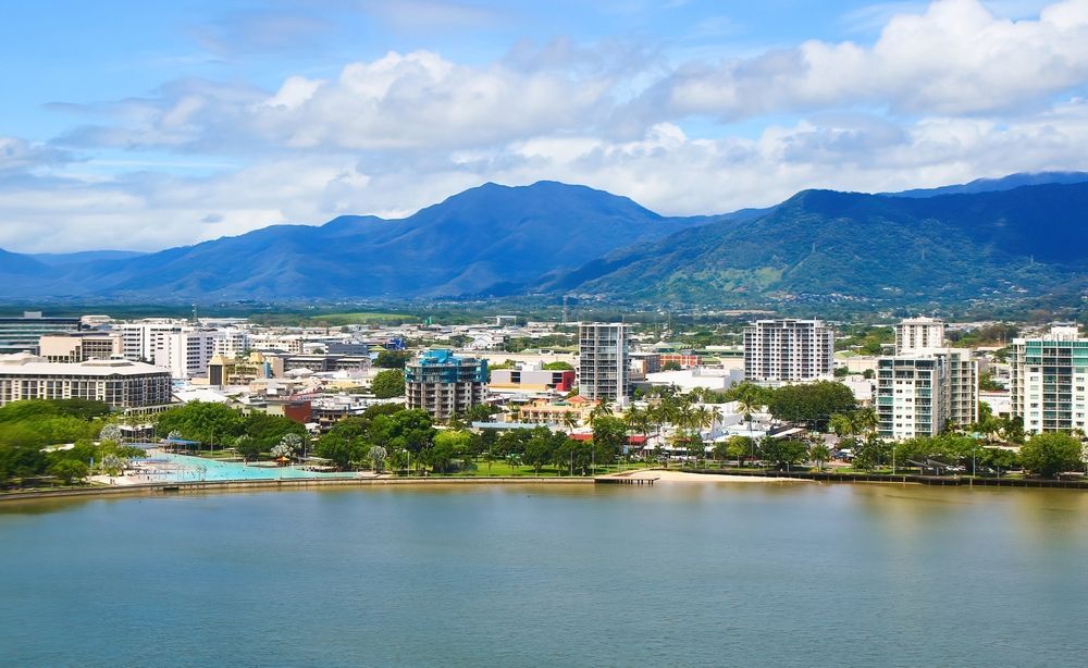 An Aerial View of a City With Mountains in the Background — Premier Inspections FNQ In Cairns, QLD