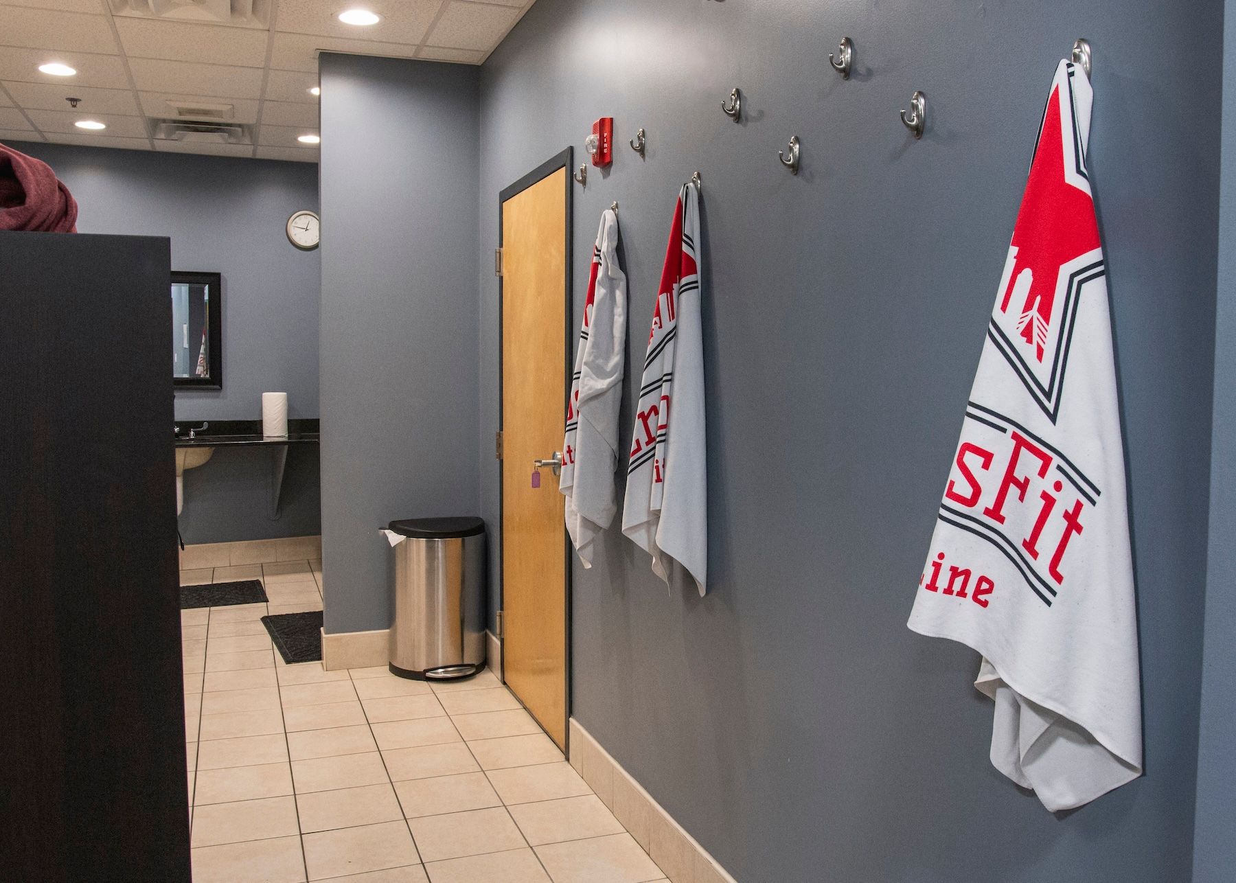 A towel that says sfit hanging on a wall