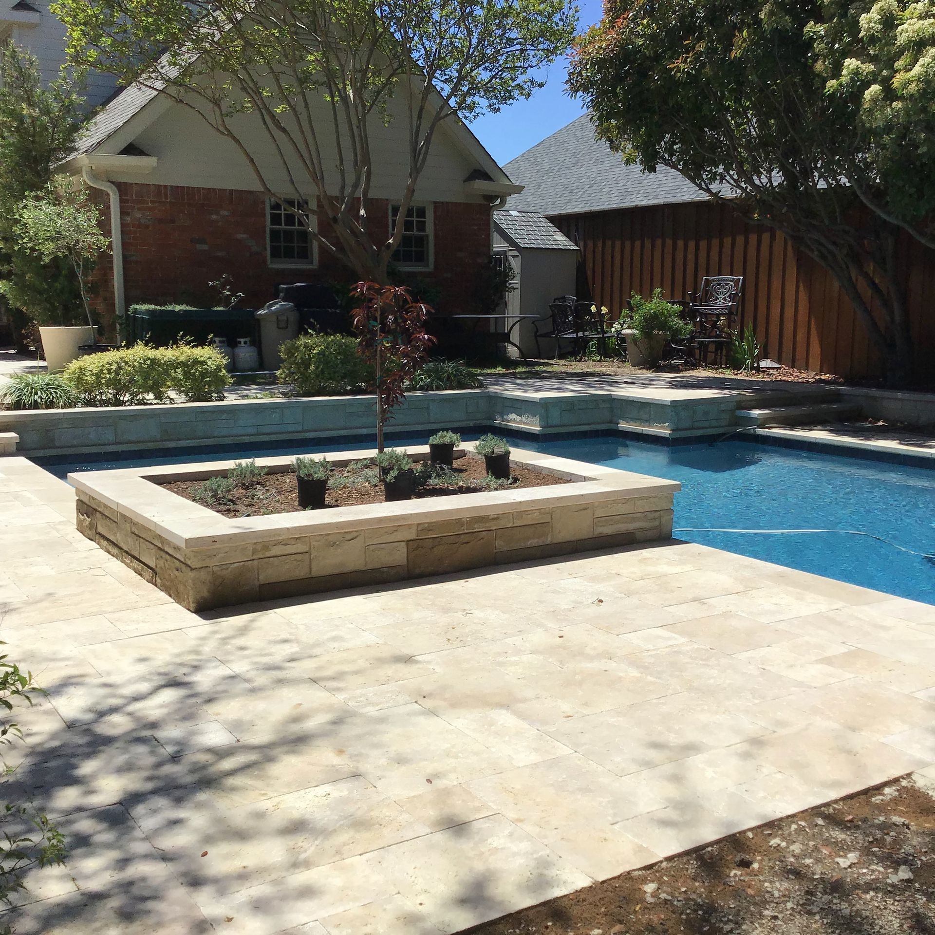 A large swimming pool in the backyard of a house