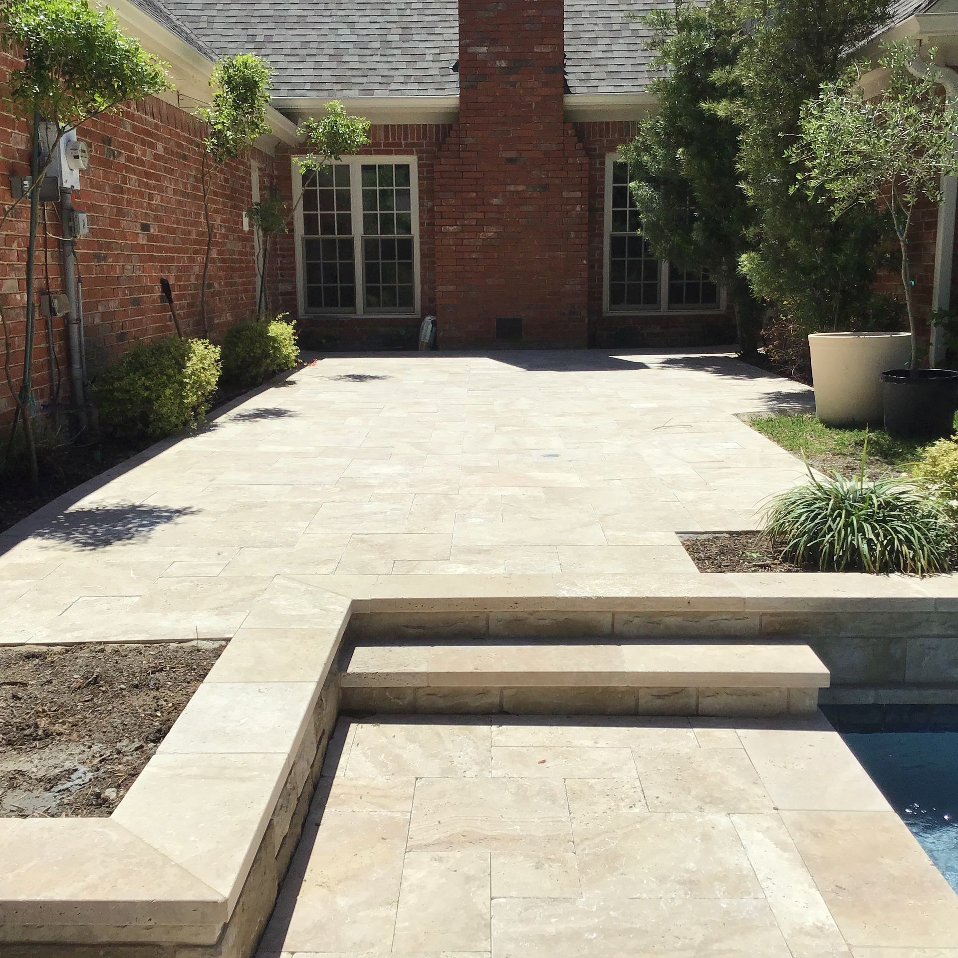 A brick house with a patio in front of it