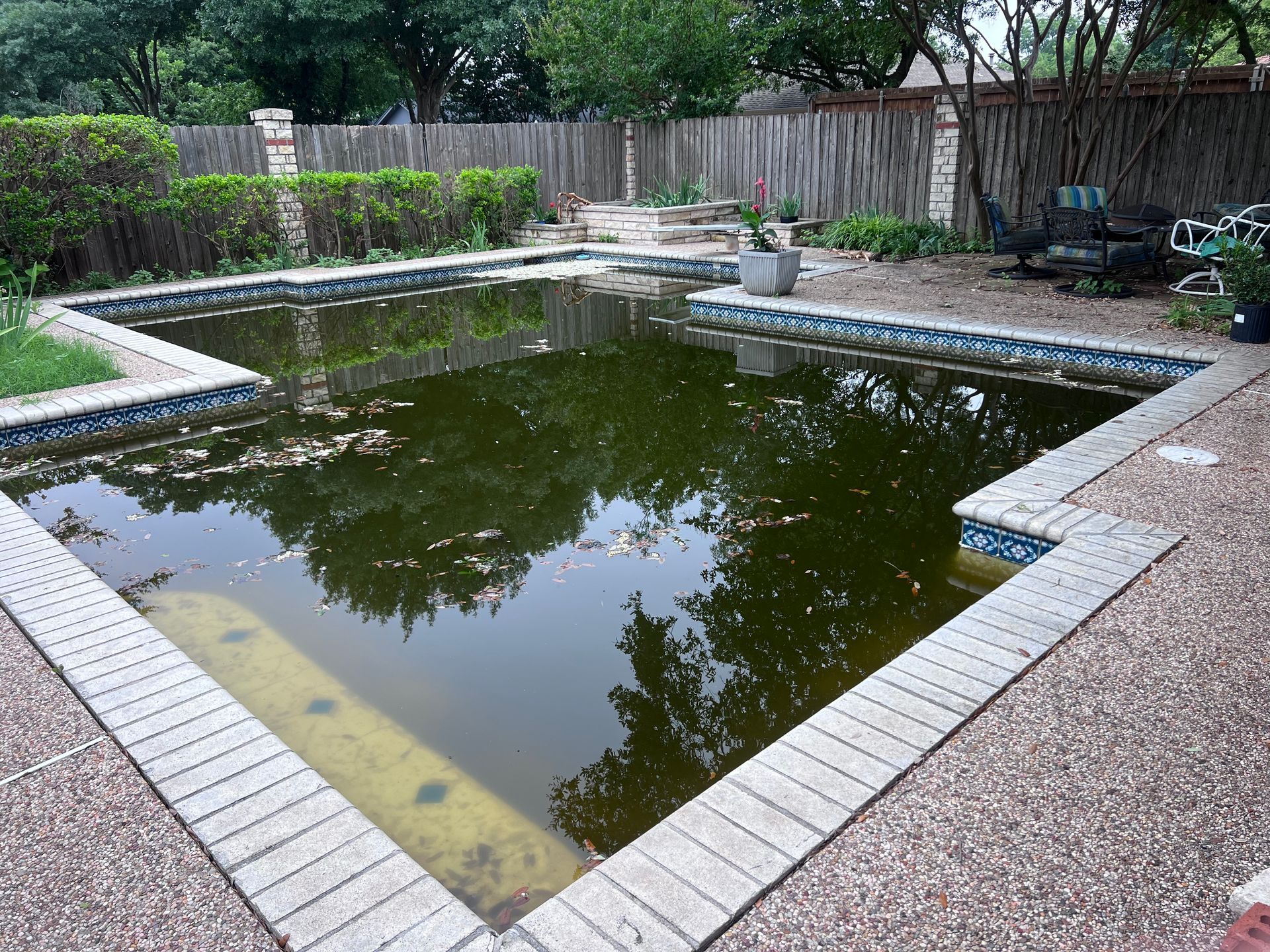 A large swimming pool with a lot of water in it