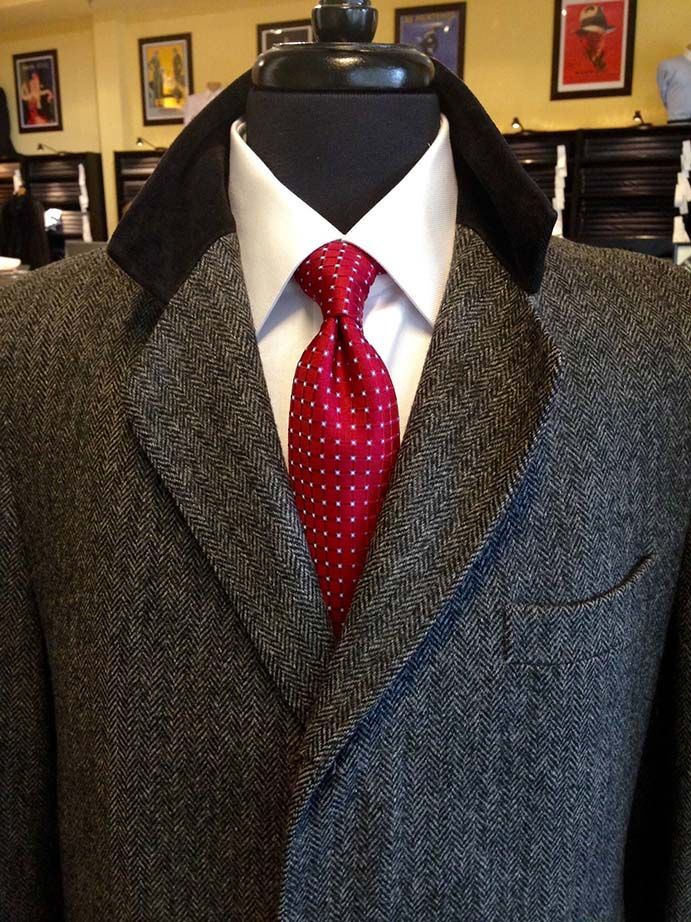 A man in a suit and tie is on a mannequin