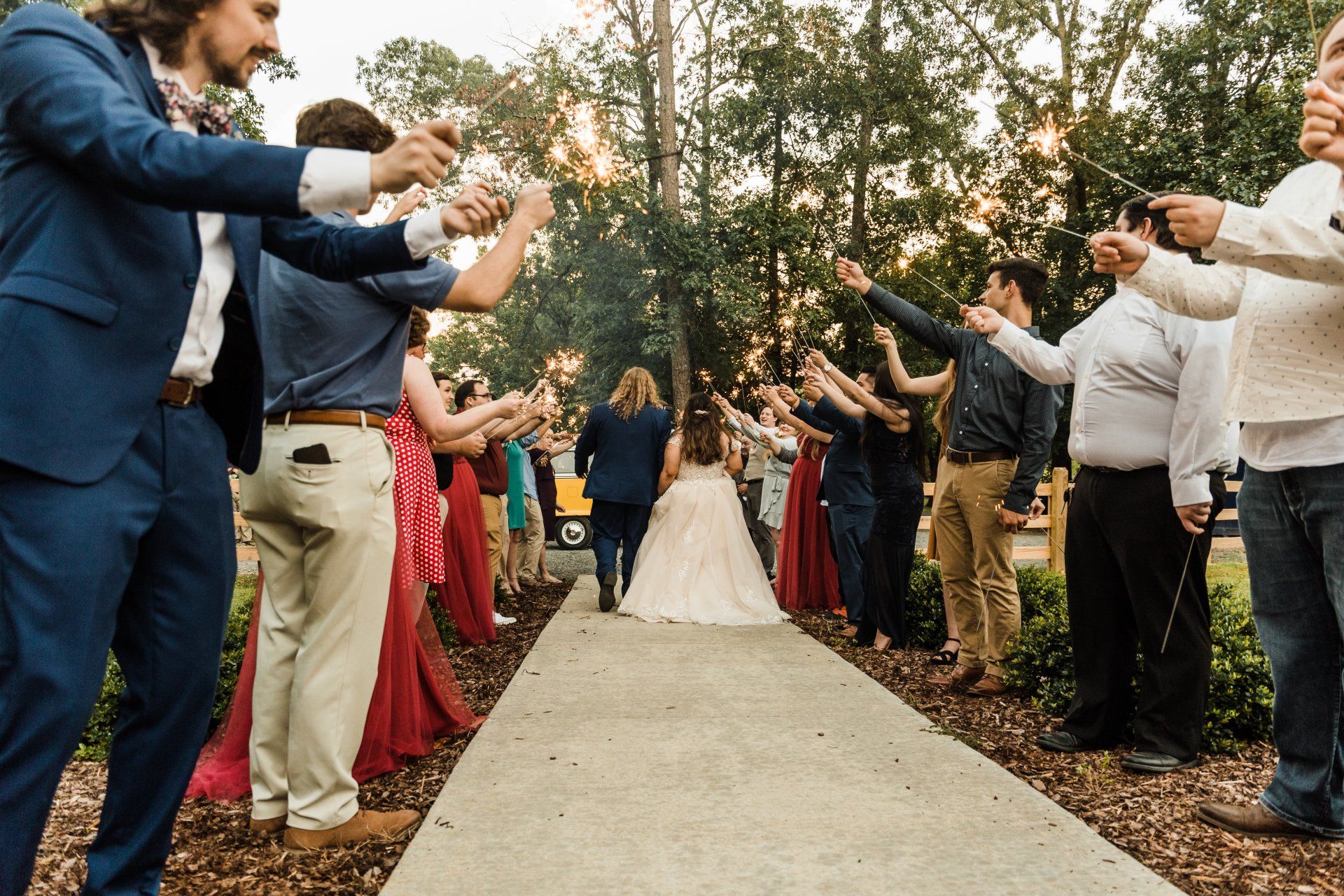 sparkler send-off with a yellow vw bus getaway car
