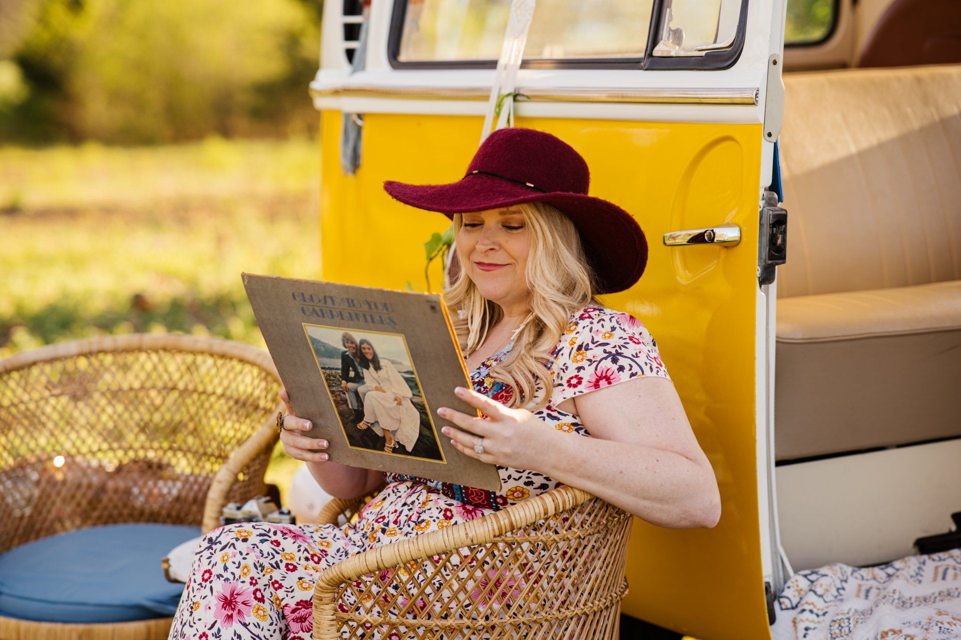 Cute young couple photo shoot with a yellow vw bus in sunflower field