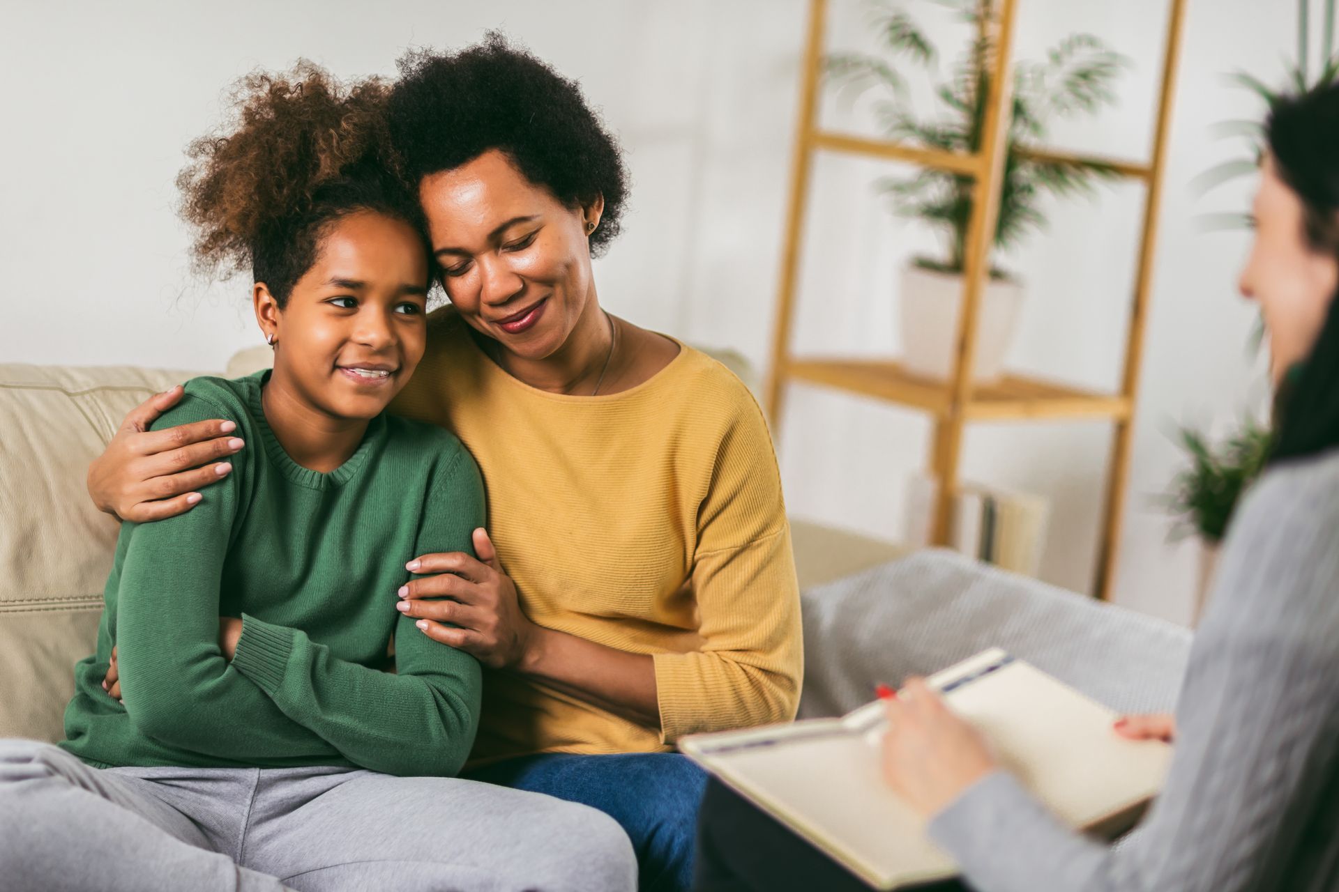 A parent with their teenager attending counseling with a teenage therapist near Columbus, OH