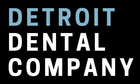 The detroit dental company logo is white on a black background.