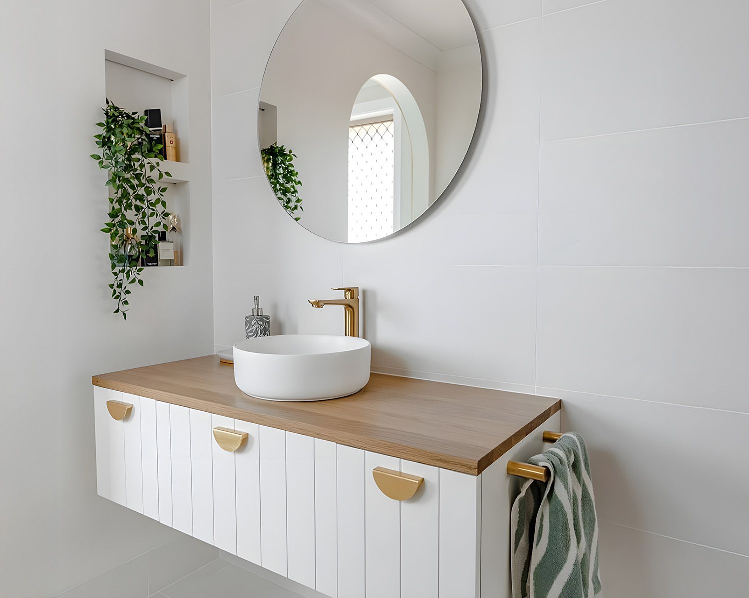 A Modern Bathroom With White Floating Vanity With A Wood Countertop