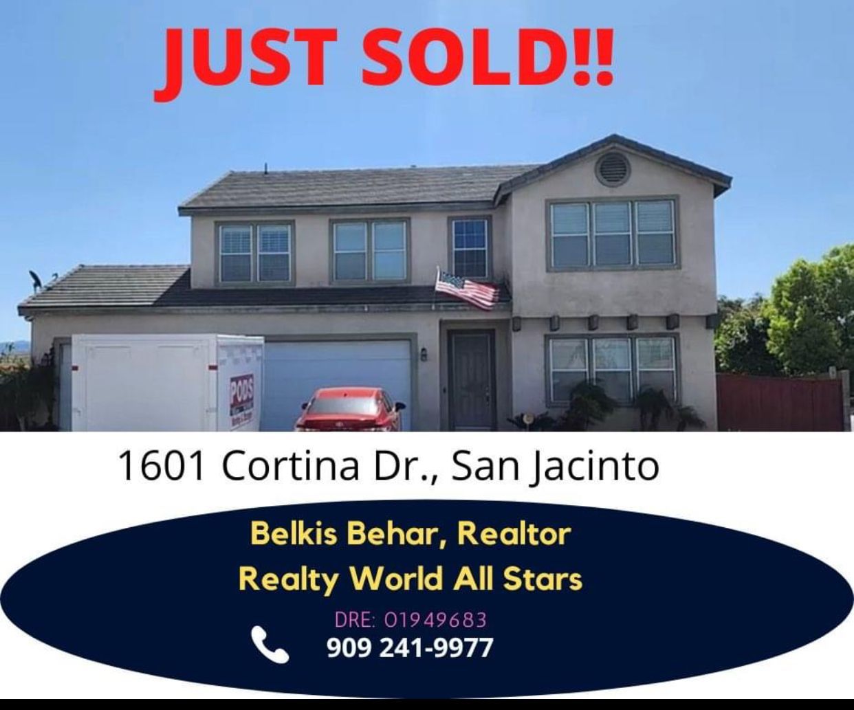 A dining room with a round table and chairs.