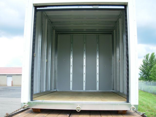 The inside of a shipping container with the door open.
