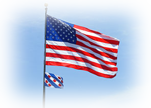 An american flag and a dutch flag are waving in the wind