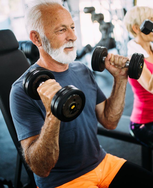 Senior Man Lifting Dumbbells — Mundaring WA — Mundaring Physiotherapy Clinic