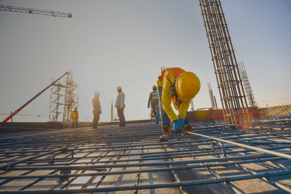 A group of construction workers are working on a construction site.