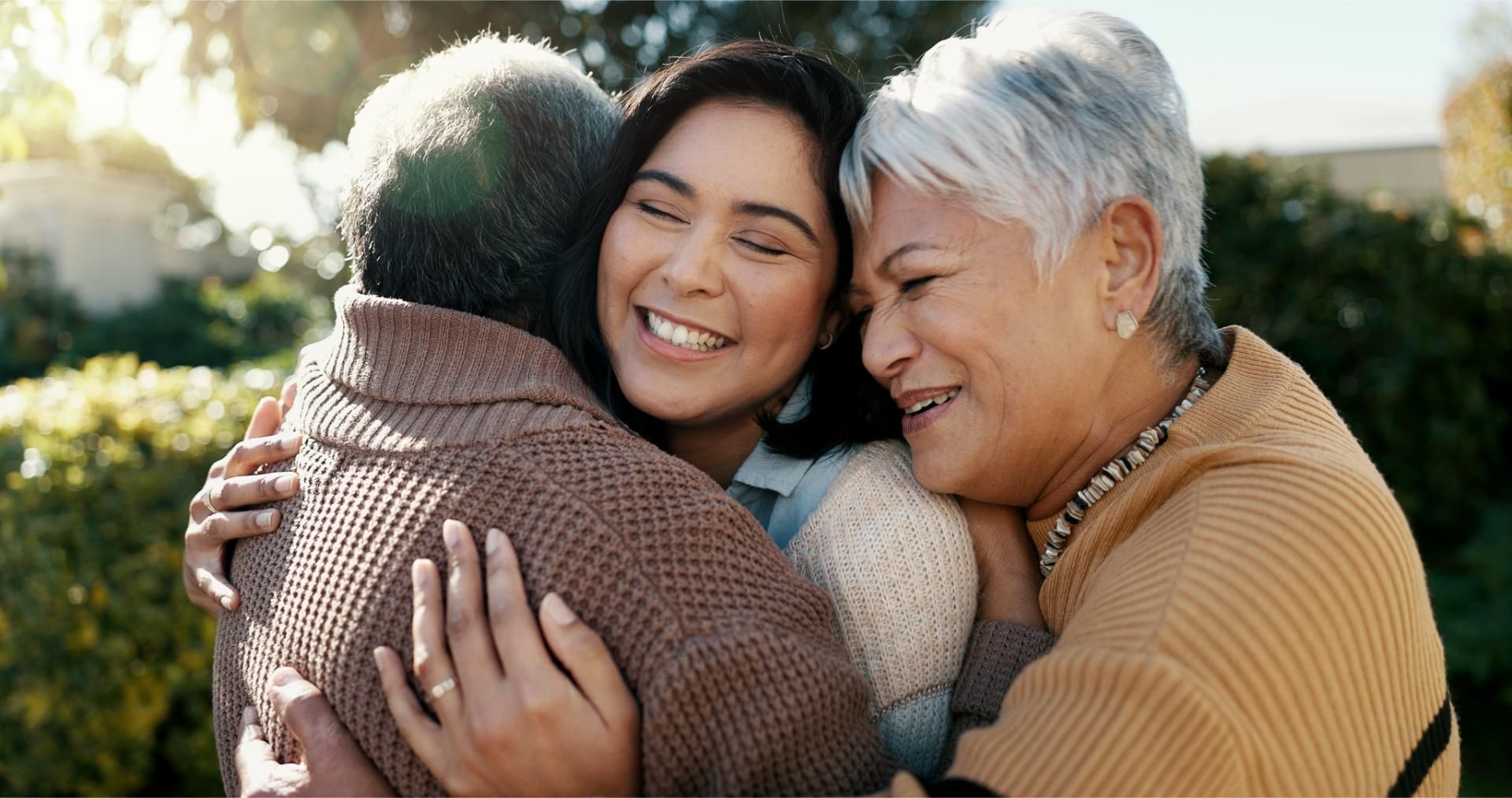 A group of people are posing for a picture together and smiling.