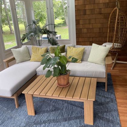 A living room with a couch and a coffee table.