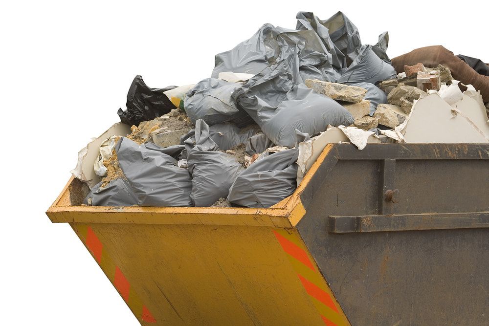 A Dumpster Filled With A Lot Of Trash On A Background — Mount Isa Skips In Mount Isa, QLD