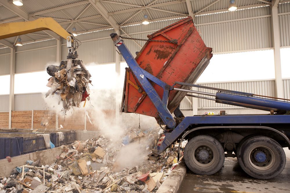 A Truck Unloading Waste at a Recycling Facility — Mount Isa Skips In Cloncurry, QLD