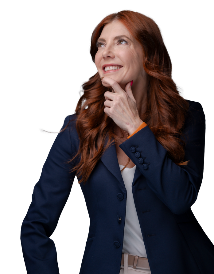 A woman with red hair is wearing a blue jacket and smiling.