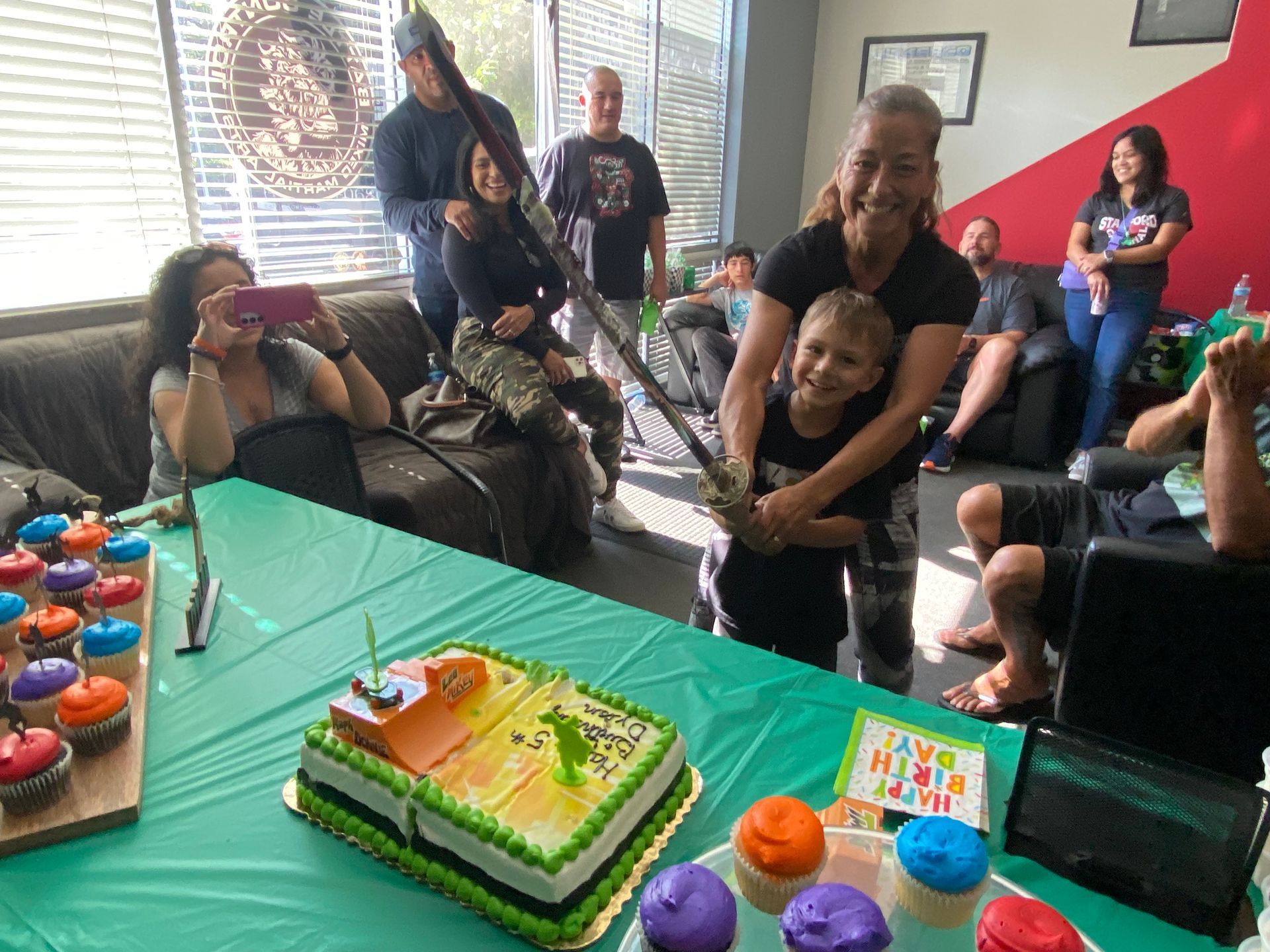 A long table with plates and balloons on it