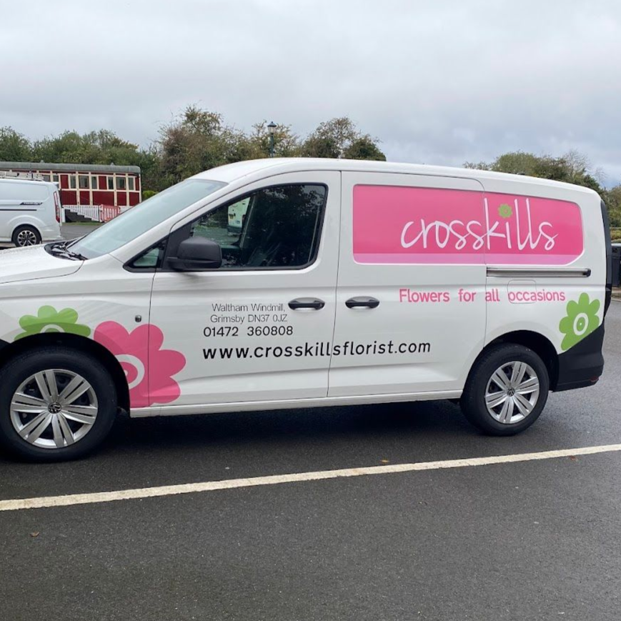 White van with pink and green floral logo for Crosskills Florist.