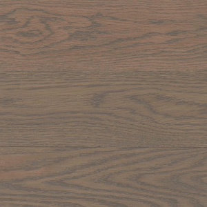 A close up of a wooden floor with a gray stain on it.