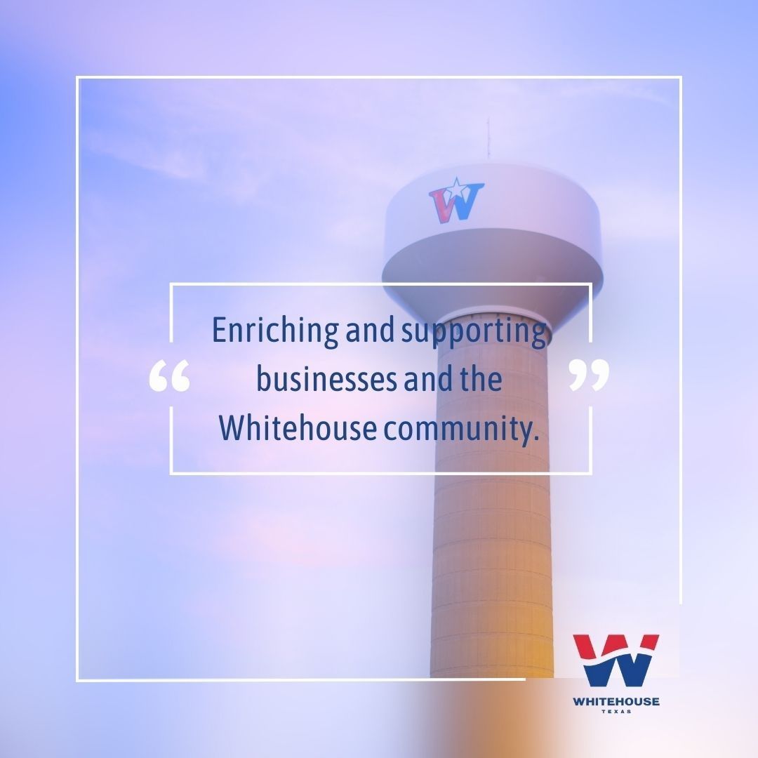 A water tower with a quote that says enriching and supporting businesses and the whitehouse community