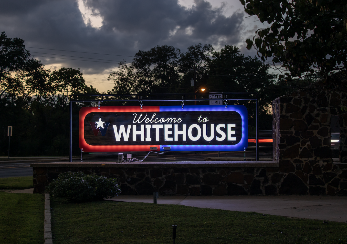 City of Whitehouse sign at night.